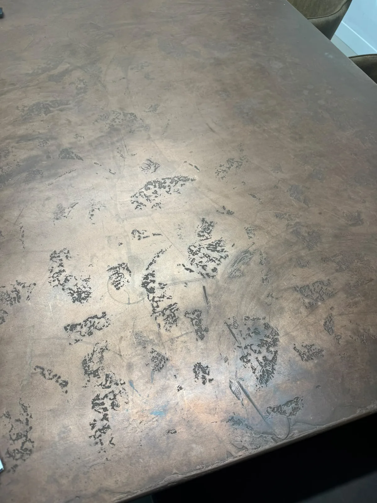 Puro Metallio liquid metal tabletop with a mottled bronze finish